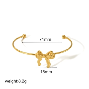 Gold stainless steel bow cuff bracelet with 71mm width and 18mm bow detail dimensions
