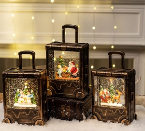 Detailed view of vintage bronze Christmas lantern with illuminated Santa and reindeer scene