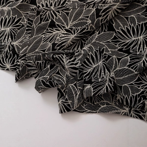 High-waist retro shorts with intricate black and white leaf embroidery pattern