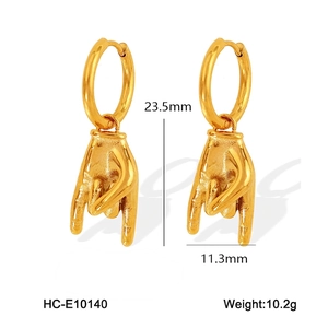 Detail showing dimensions 23.5mm by 11.3mm of gold rock gesture hoop earrings