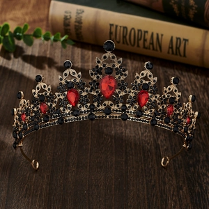 Detailed view of Baroque bridal crown with red teardrop gems and black rhinestones