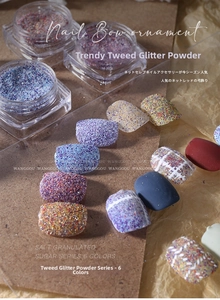 Detail of 6-color tweed nail powder set with sugar texture on professional tips