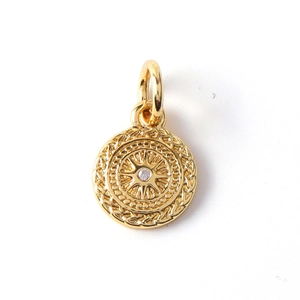 Detail of gold-plated eye-design charm with sparkling center zircon and rope edge