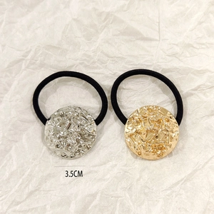 Detail of 3.5CM gold and silver hollow metal ponytail holders with hammered texture