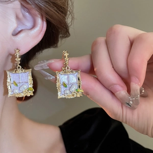 Vintage gold rectangle earrings with purple enamel leaf pattern and small pearls