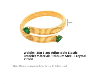 Detail of 10mm snake bone elastic gold bracelet with heart green zircon in titanium steel
