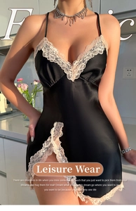 Detail of black satin nightdress with delicate beige floral lace trim and V-neckline