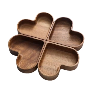 Stackable heart-shaped solid wood trays in a four-leaf clover arrangement for candy and nuts