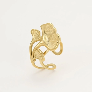 Detail view of 18K gold ginkgo leaf ring showing textured metal and adjustable band