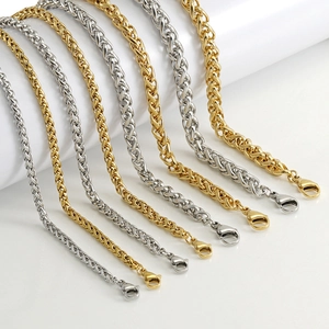 Detail of wheat link chains in gold and silver steel with secure lobster clasps