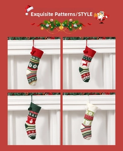 Detail view of four knitted Christmas stockings with snowflake and reindeer patterns