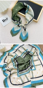 Detailed pattern of silk square scarf featuring elegant belt and chain geometric design