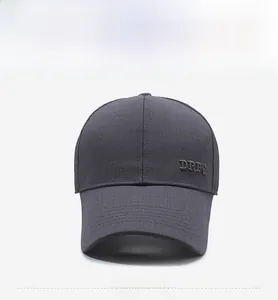 Detailed view of the DRTS embroidered logo on a dark grey casual mesh baseball cap