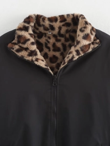 Detail shot of the plush leopard print faux fur collar and black zip-up bomber jacket