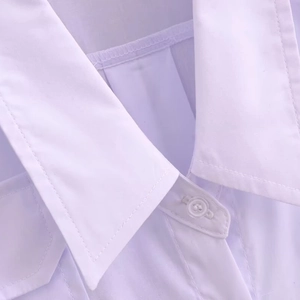Women's white deep V-neck blouse with formal collar and polished button detail