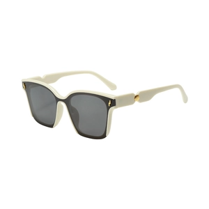 Modern oversized square sunglasses in cream and black with stylish gold metal accents