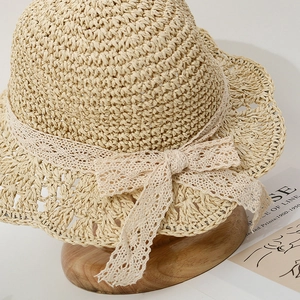 Beige woven straw sun hat for baby girls featuring elegant lace bow and scalloped brim