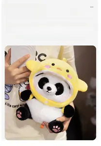 Detail of panda plush in yellow duck hoodie showing soft velvet fabric and embroidery