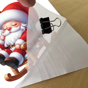 Detail showing the transparency and peeling of the Santa Claus vine wall sticker on wood