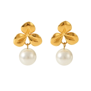 Detailed view of 18K gold plated floral stud earrings with round white pearl pendants