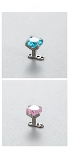 Detail of 6mm dermal anchor featuring pink and blue zircons with G23 titanium base