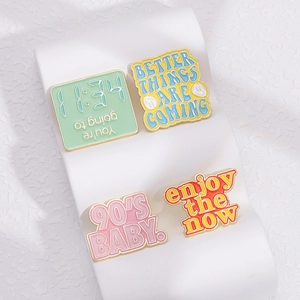 Creative colorful enamel heart brooch set with inspirational quotes on white display