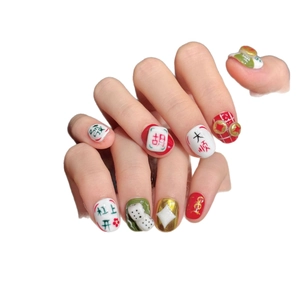 Handcrafted mahjong theme press-on nails with red green patterns and lucky calligraphy