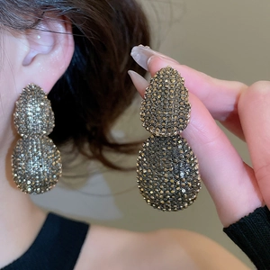 Detailed view of vintage-style double oval earrings with dark grey pavé rhinestones