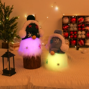 Set of two glowing Christmas gnomes with LED lights and knitted texture on a festive background