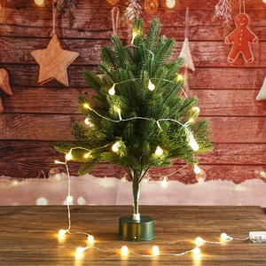 Mini desktop Christmas tree detail with warm white LED lights and dark green base