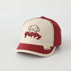 Close-up of the red puppy embroidery and SHSHXIANG brand label on the baseball cap