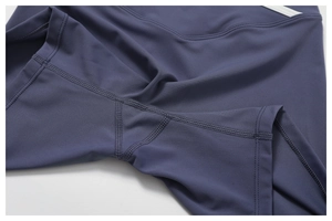 Close-up of four-needle six-thread flat seams and gusset crotch on yoga shorts