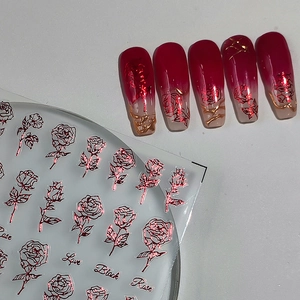 Rose-themed laser gold foil nail stickers with floral patterns and artistic lettering
