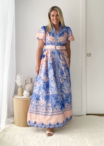 Detail of bohemian floral print shirt dress with puffed sleeves and matching waist belt