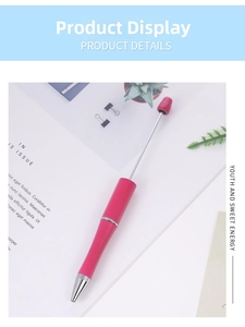 Detail of pink telescopic pointer ballpoint pen with matte finish on magazine