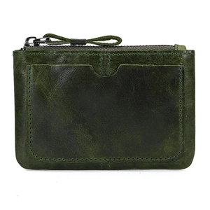 Close-up of green leather coin purse showing zipper detail and external card slot