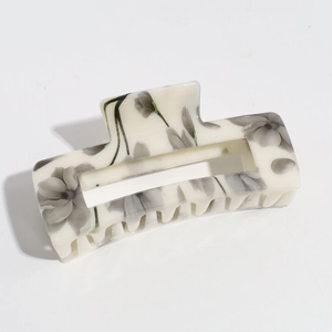 Detailed macro view of the rectangular hair claw clip with ink wash tulip flower prints