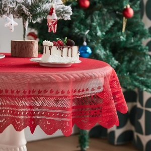 Red Christmas lace tablecloth with festive geometric patterns and scalloped edges