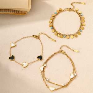 Chic set of three golden titanium steel heart bracelets with shell inlays and blue stones