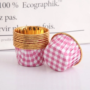 Detail of pink plaid cupcake liners with gold foil edges and inner lining