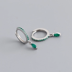 Detail view of S925 sterling silver earrings featuring green zircon stones in various cuts