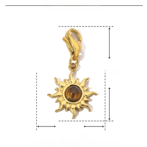 Macro detail of sun-shaped stainless steel pendant with natural stone and dimensions
