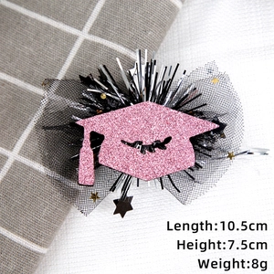 Pink glitter graduation cap hair clip with black veil and silver tinsel details
