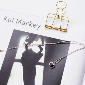Elegant S925 sterling silver necklace featuring a black heart pendant with beaded edges