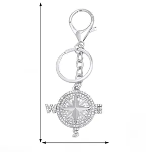 Detail view of silver eagle compass keychain with sparkling rhinestones and lobster clasp
