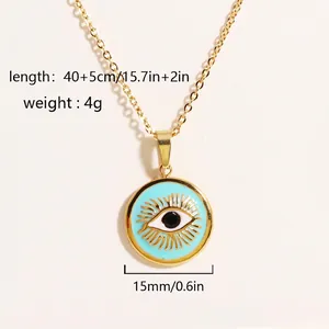 Macro detail of gold-plated evil eye pendant with light blue enamel and sunburst texture