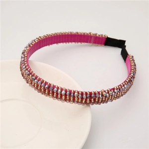 Baroque crystal beaded headband with purple and gold rhinestones on pink fabric base