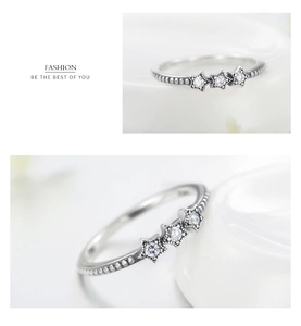 Detail of S925 silver beaded ring with sparkling star charms and white zircon stones