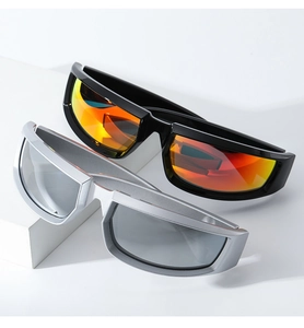 Close-up of sporty oversized sunglasses with orange and grey reflective lenses