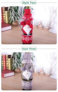 Detail of Christmas Santa knitted wine bottle covers in festive red and green colors